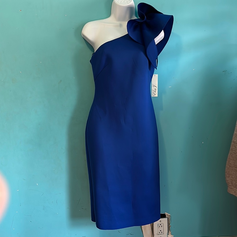 Royal blue cocktail dress. One sleeve. Size 4 with tags.